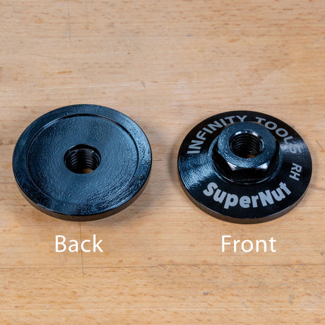 Two black metal weight plates shown on a light wood surface, labeled Back and Front, with the front plate showing white text that reads 'INFINITY TOOLS RH superNut'.