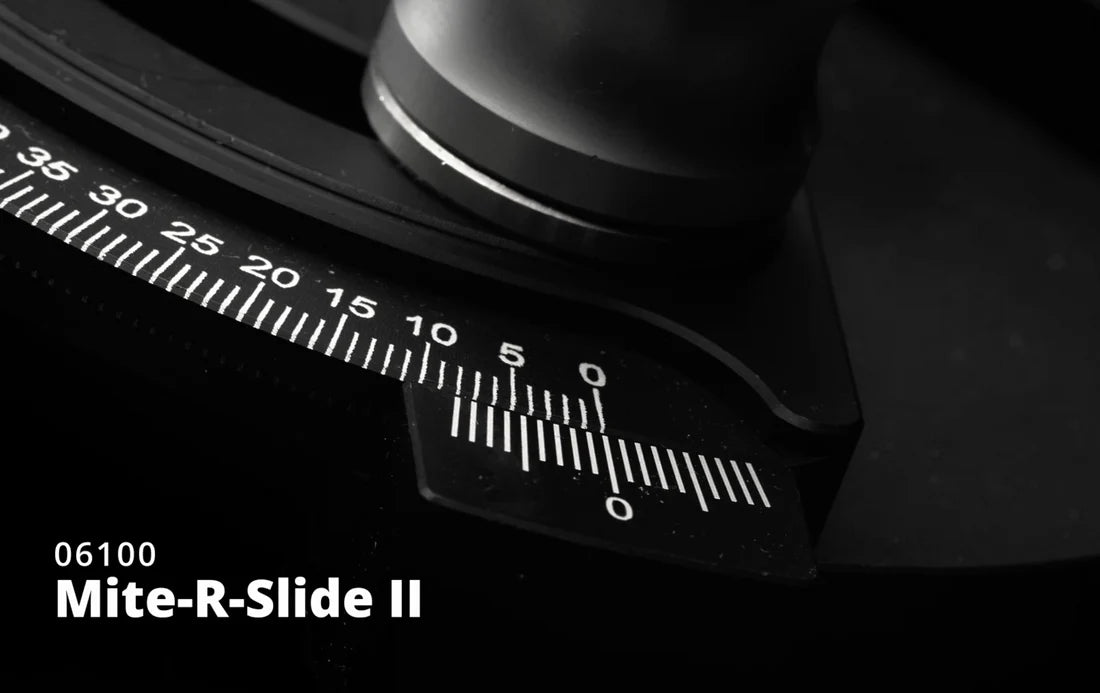 Close-up of Mite-R-Slide II woodworking miter gauge with angle scale and adjustment knob.