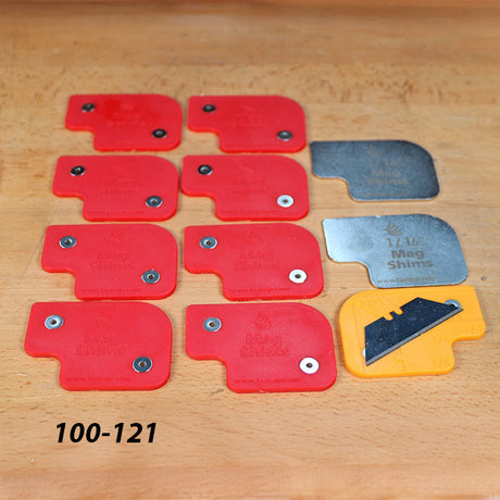 Set of Mag Shims and measuring blade for woodworking, red and yellow shims on wooden surface
