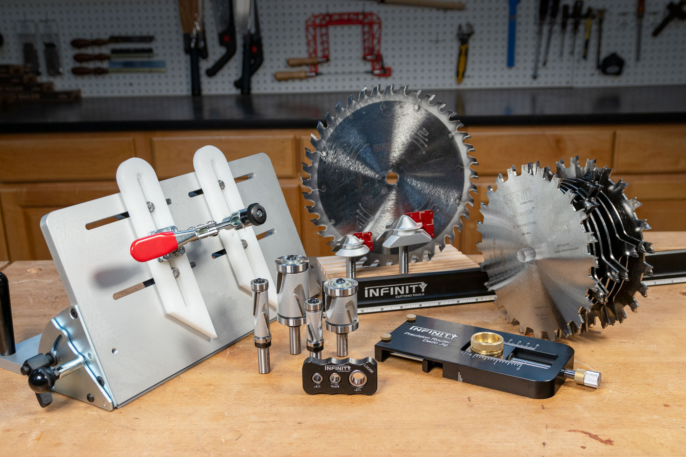 Assorted woodworking tools including saw blades, jigs, and router bits on workbench