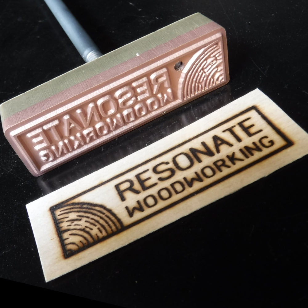 Woodworking branding iron with engraved metal stamp and burned wood logo impression