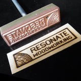 Woodworking branding iron with engraved metal stamp and burned wood logo impression