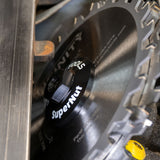 Close-up of SuperNut locking nut on circular saw blade for woodworking tools