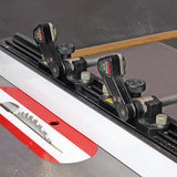 Table saw with adjustable featherboard fence system and visible carbide-tipped saw blade