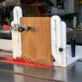 Table saw tenoning jig holding wood vertically for precise woodworking cuts