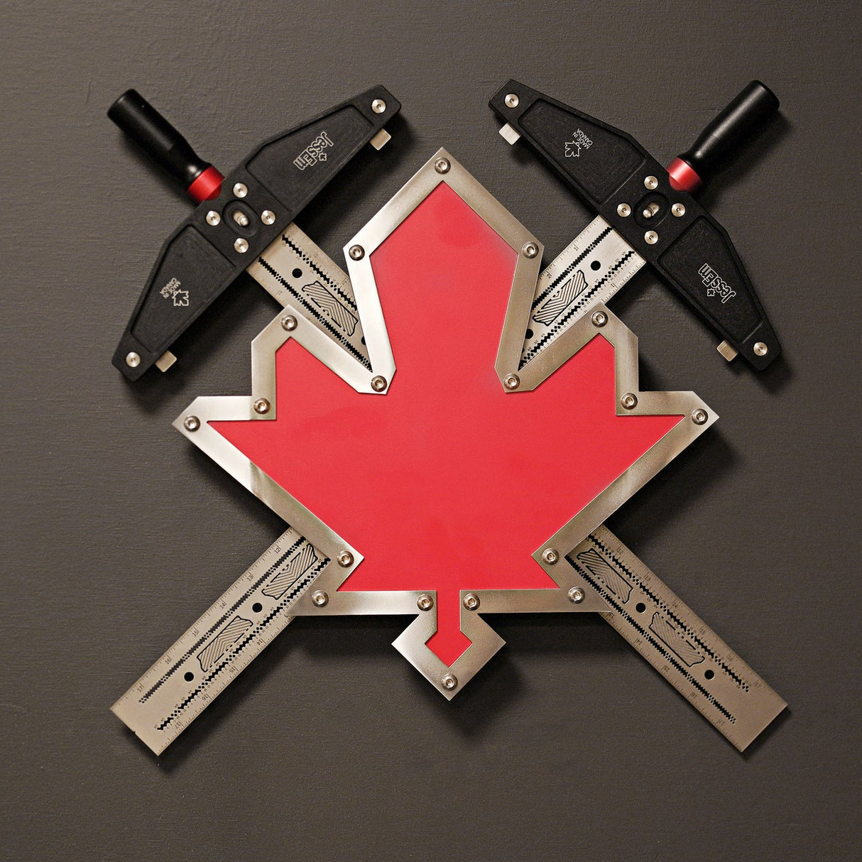 Metal maple leaf wall decor with intersecting precision woodworking squares