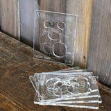 Clear acrylic teddy bear template stencils for woodworking on rustic table