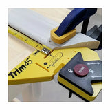 Trim45 yellow measuring jig clamped to wood, used for precise woodworking and trim layout