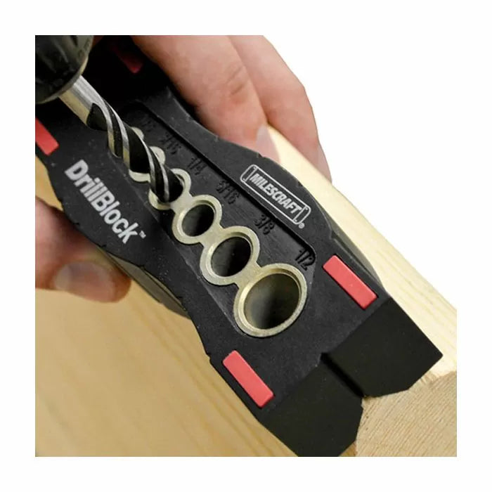Drill guide block used for precise wood drilling, showing multiple hole sizes and a hand-held drill.