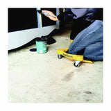 Person using KneeBlades knee pads with wheels while painting furniture on a workshop floor