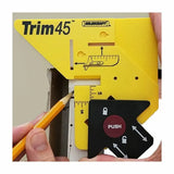 Yellow Trim45 marking tool for woodworking placed on wall corner, with pencil marking guide