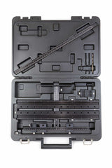 Woodworking dowel jig kit with ruler, drill bits, and guides in a hard plastic carrying case