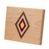 Wood inlay sample with multicolored diamond pattern on light maple board, woodworking design