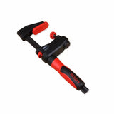 Adjustable woodworking clamp with red and black handle and padded jaws on white background