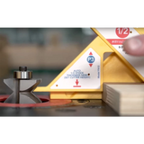 Router table setup with router bit, yellow gauge, and wood stock for precise cutting