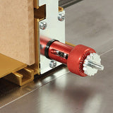 Router table micro-adjuster with red knob installed on a woodworking fence system
