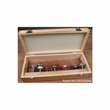 Empty wooden storage box for router bits displayed open on a workbench