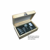 Wooden storage box with foam insert holding metal woodworking router bit set and accessories.