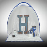 Portable spray shelter with painted wooden letter H, spray paint can, and paint sprayer inside