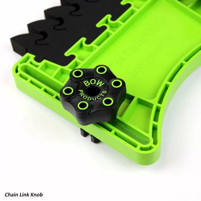 Green and black chain link knob for woodworking jig or fixture, close-up view