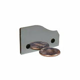 Carbide planer knife with sharp edge and two holes, shown next to two coins on white background
