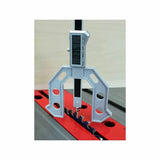 Digital caliper measuring saw blade height on a table saw for precise woodworking setup