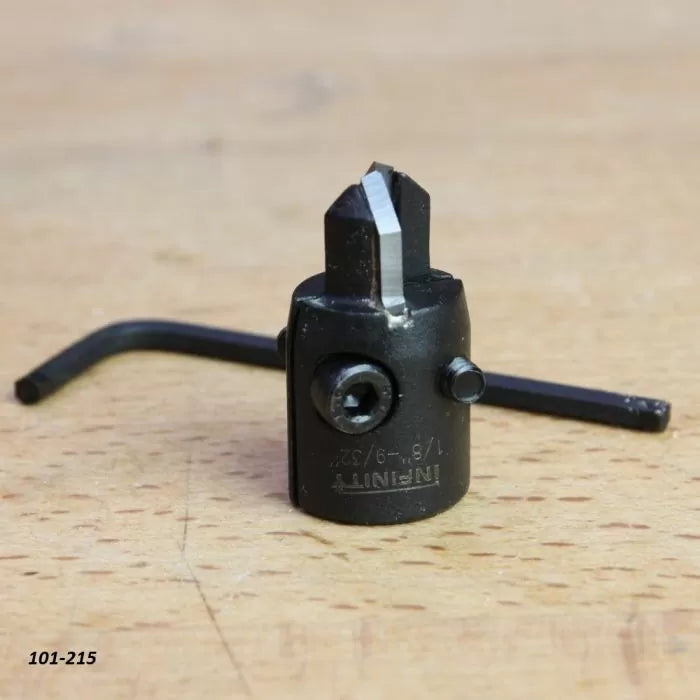 Adjustable woodworking router bit depth stop collar with hex key on a wood surface