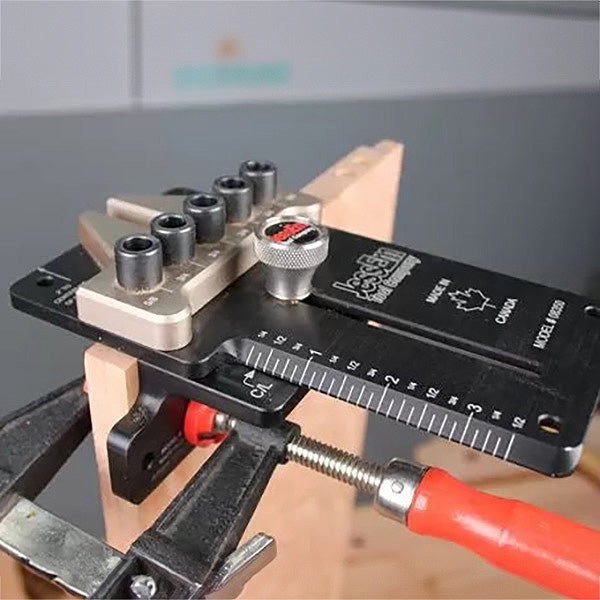 Dovetail joint jig clamped to wood board for precise woodworking joinery