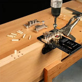 Woodworking dowel jig clamped to wood, with drill and dowel pins on workbench