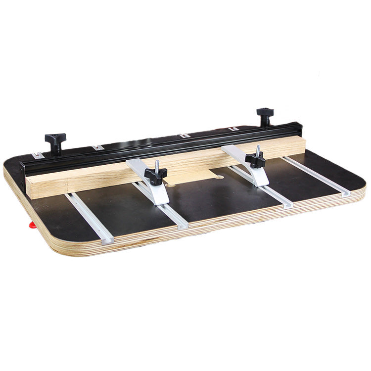 Router table fence system with adjustable clamps and T-tracks on a wood base
