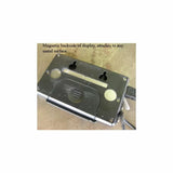 Magnetic digital display tool with metal mounting holes on a workbench surface