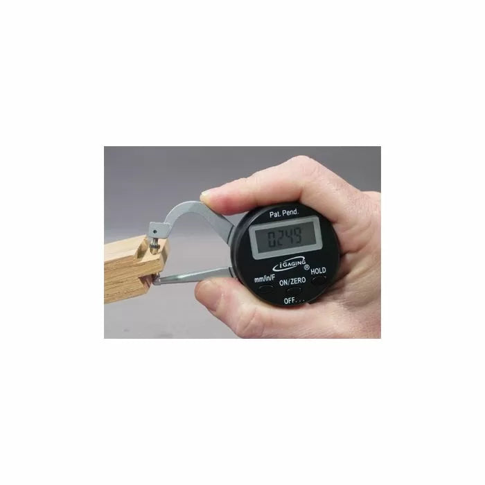 Digital caliper measuring wood joinery for precise woodworking thickness