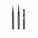 Three spiral router bits for woodworking, each with different flute designs