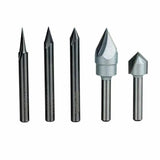 Set of five woodworking router bits and countersinks on white background