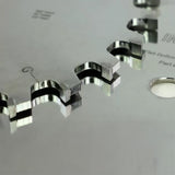 Close-up of carbide-tipped saw blade teeth for woodworking precision cutting.