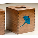 Handcrafted wooden tissue box with dovetail joints and blue leaf inlay, woodworking project.