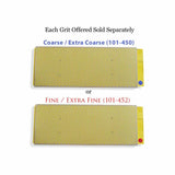 Two rectangular diamond sharpening stones with yellow-dot surfaces, coarse and fine grits
