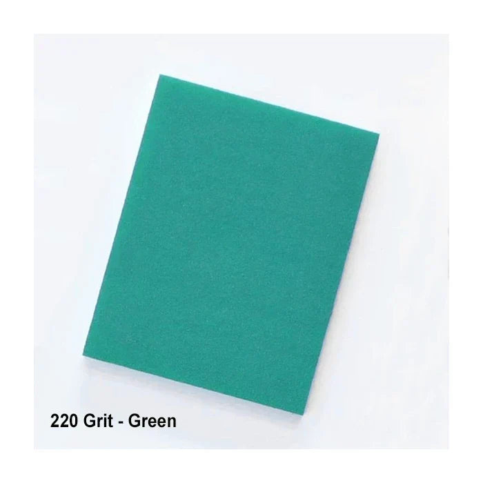 Green 220 grit sanding sponge for woodworking, rectangular, on white background.
