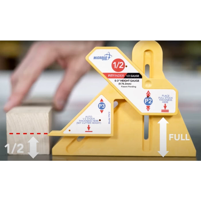 Yellow woodworking height gauge tool measuring half and full thickness of wood block