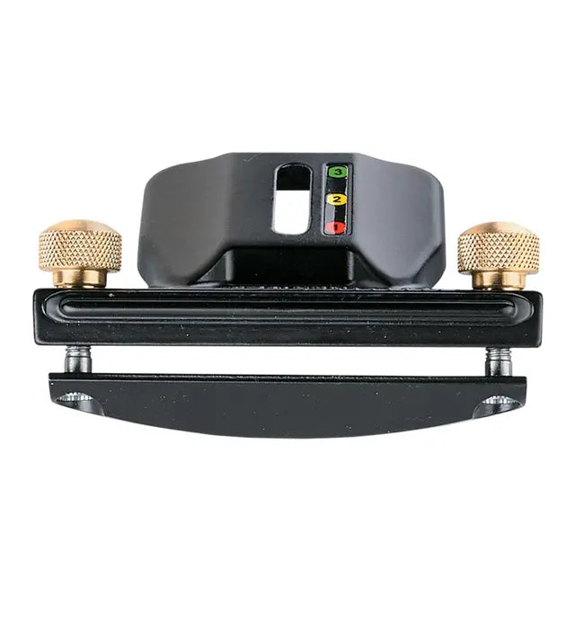 Woodworking router jig with black body, brass adjustment knobs, and color-coded guide indicator