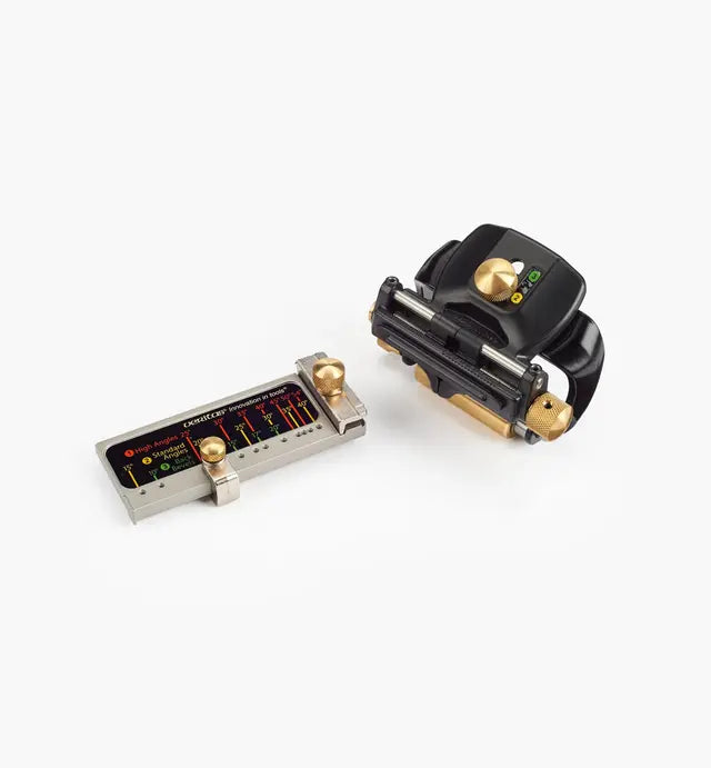 Precision woodworking honing guide and angle setting tool with brass knobs on white background
