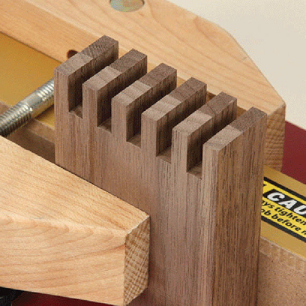 Box joint jig holding wood for precise dovetail joinery woodworking