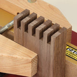 Box joint jig holding wood for precise dovetail joinery woodworking