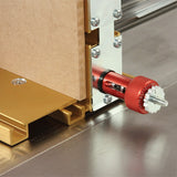 Router table fence with micro-adjustment knob and MDF panel on a woodworking tool base