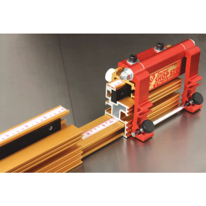 Telescoping aluminum fence with integrated measuring scale for woodworking precision.