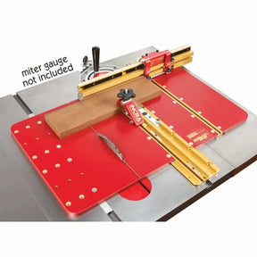 Table saw crosscut sled with red base, gold rails, and wood workpiece for precision woodworking