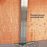 Close-up of bandsaw blade cutting hardwood, showing precision ground and placed weld.