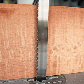 Bandsaw blade cutting hardwood for precise woodworking