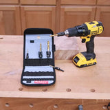 Cordless drill and drill bit set in case on a woodworking bench, ideal for precision woodwork.