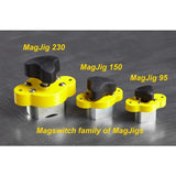 Three yellow MagJig magnetic woodworking clamps—MagJig 230, 150, and 95—on a metal surface.